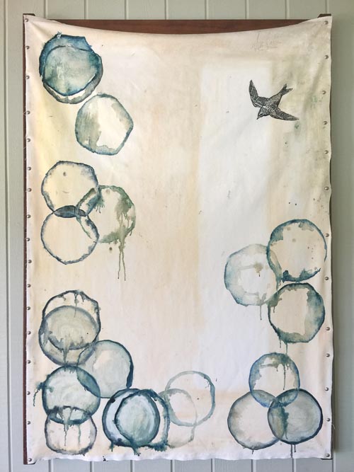 Artwork featuring bird descending upon circles